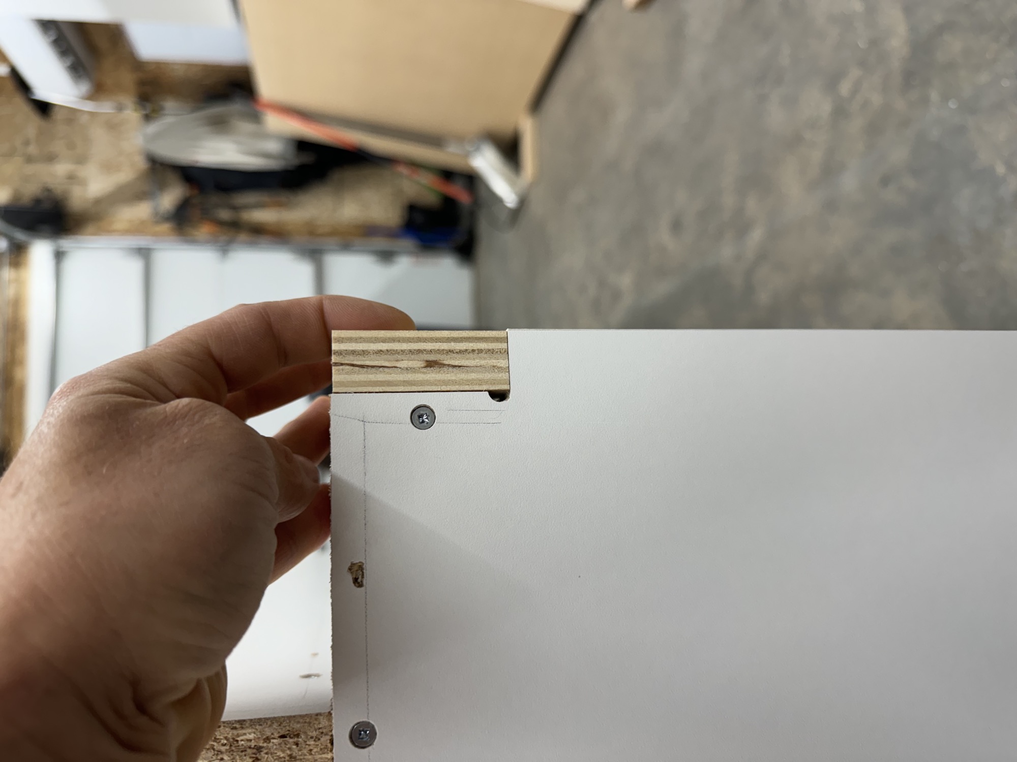 Cabinet door edge preparation before finishing.