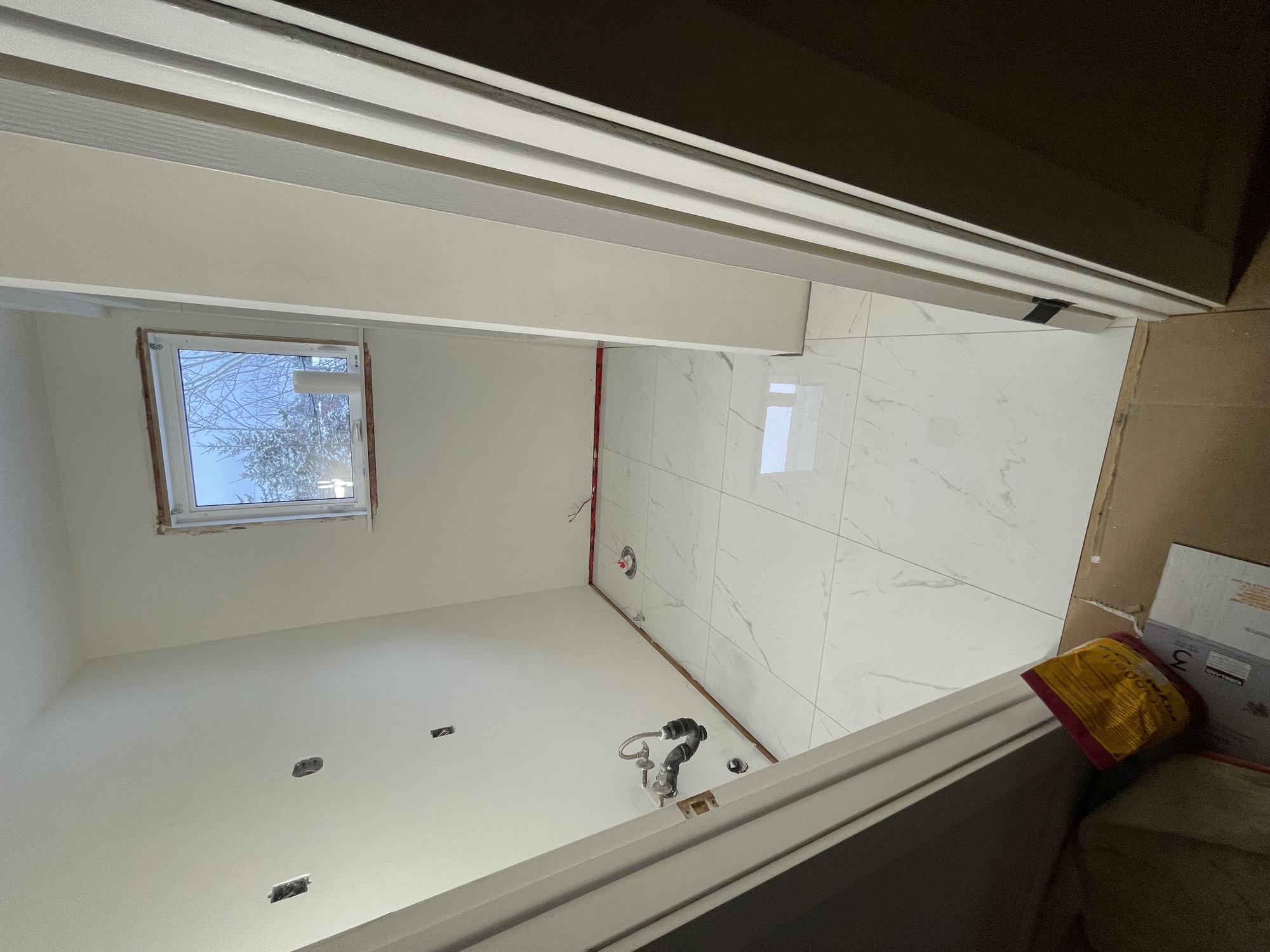 Luxury bathroom with large tile work.