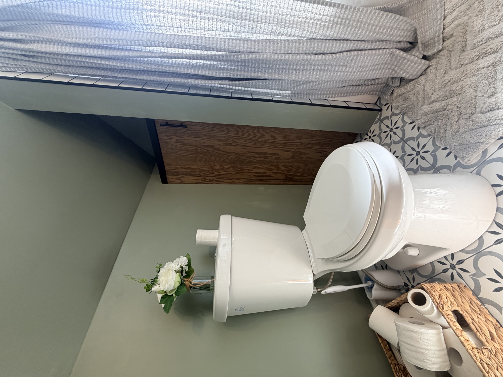 Finished bathroom detail with refreshed fixtures and flooring.