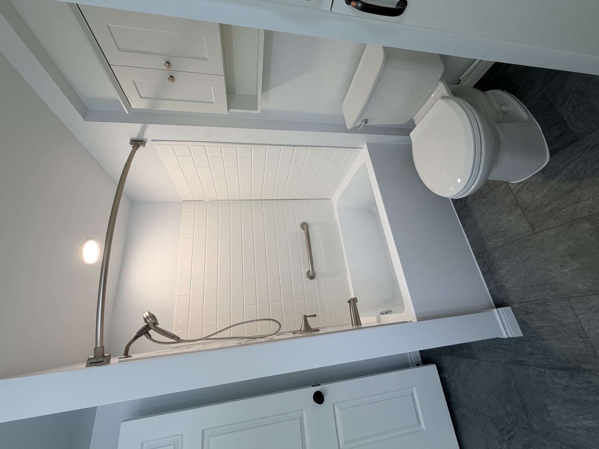 Updated bathroom with new tub and vanity.