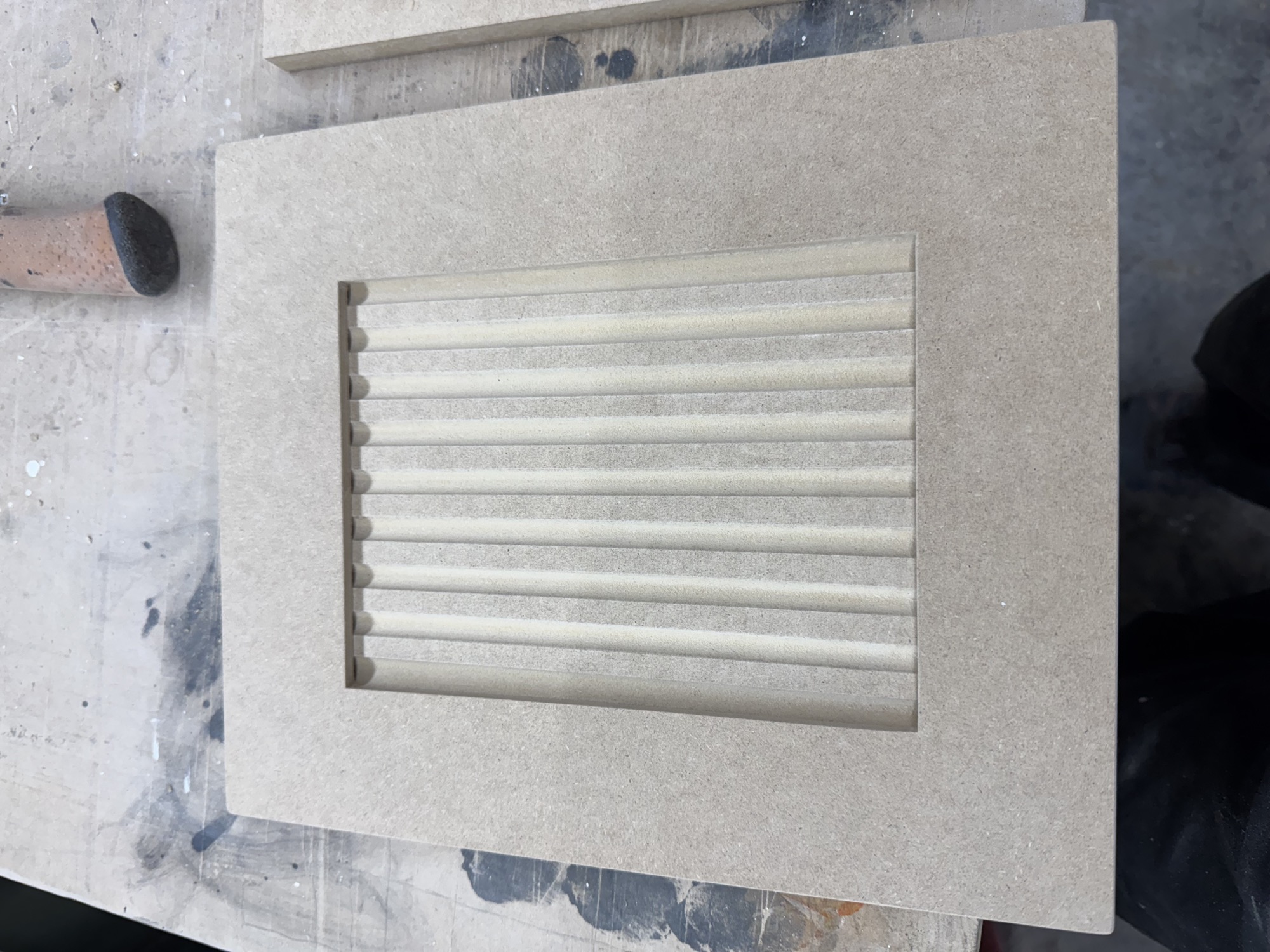 Decorative cabinet door insert prepared for finishing.
