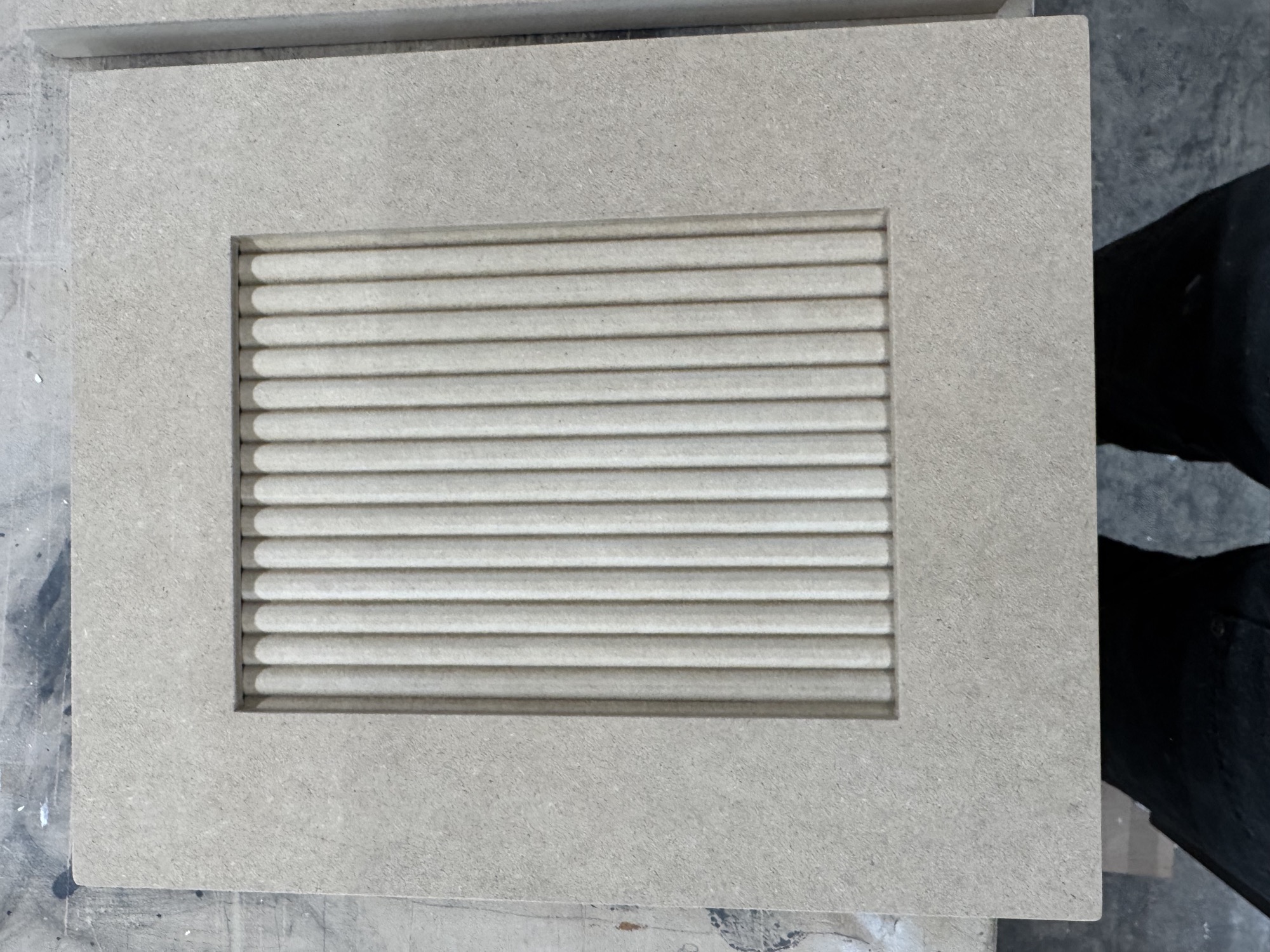 Finished decorative cabinet door insert.