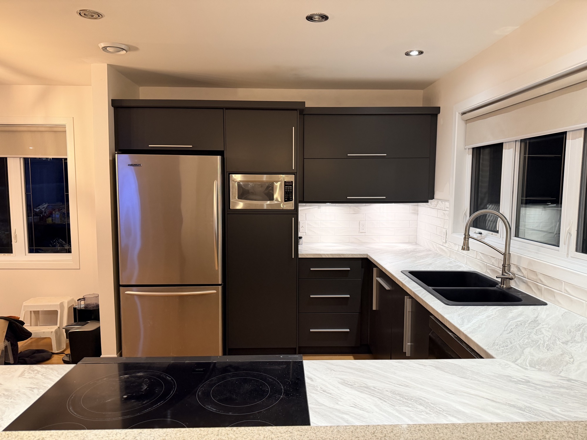 Kitchen refinishing update with fresh cabinet finish & backsplash.