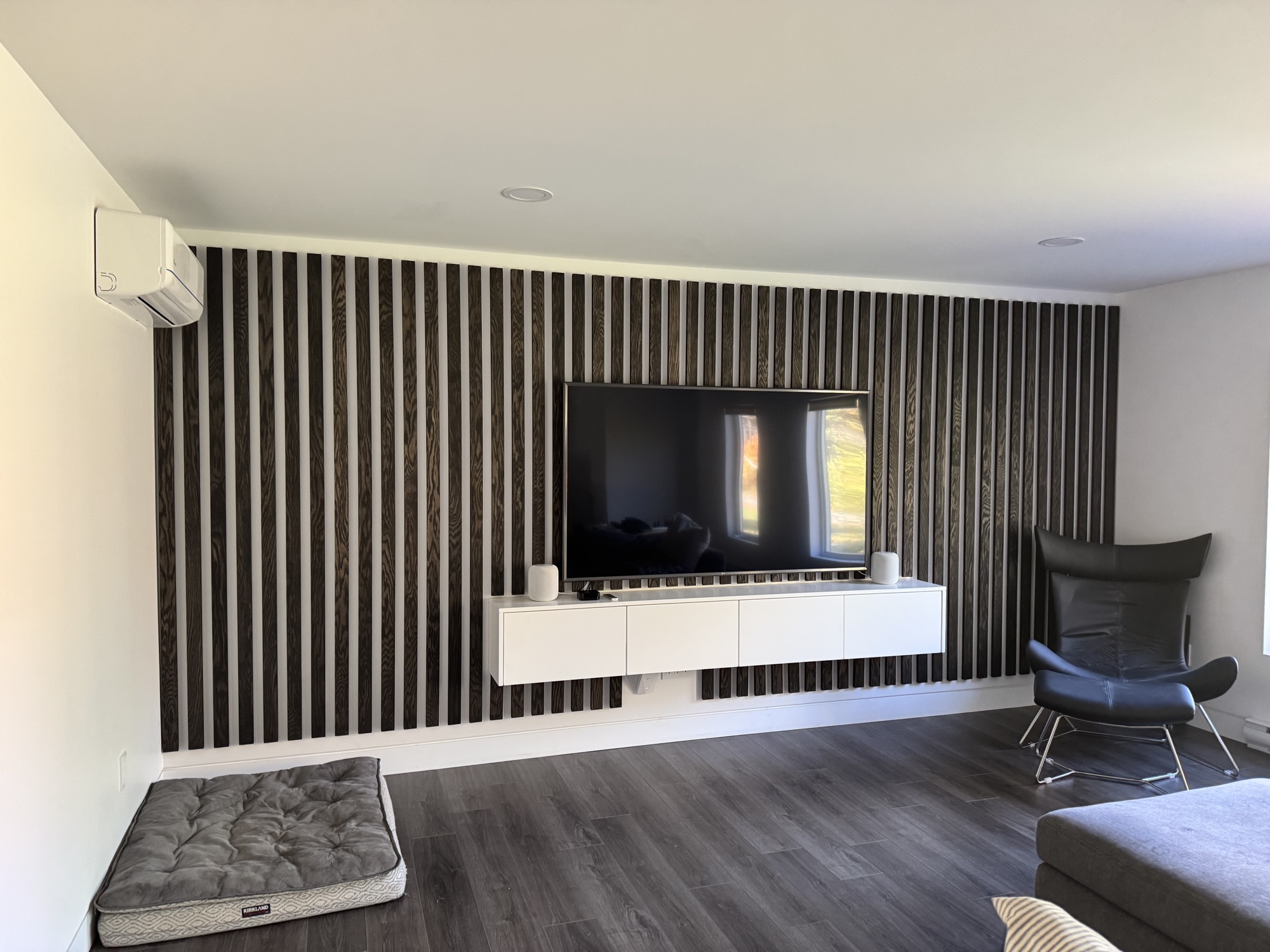 Modern living room accent wall with built-in shelving for a unique look.