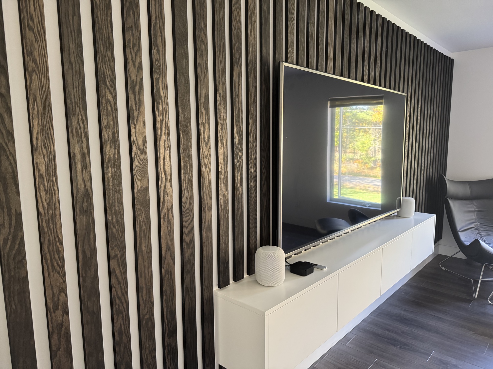 Modern living room accent wall with built-in shelving for a unique look.